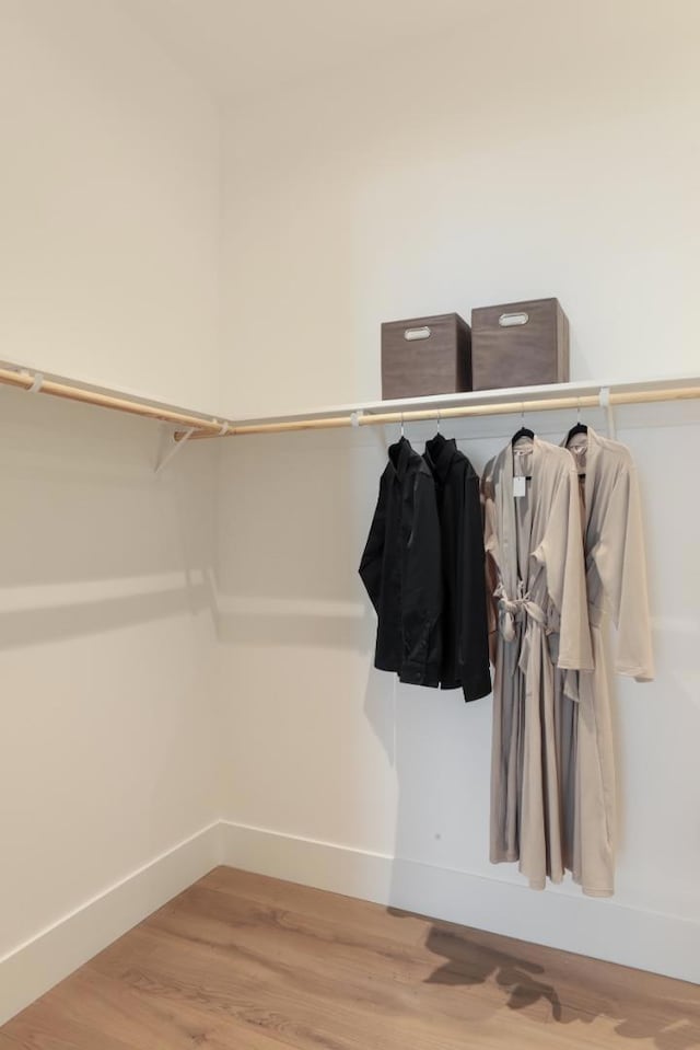 walk in closet featuring hardwood / wood-style floors