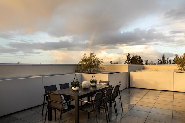 view of patio terrace at dusk