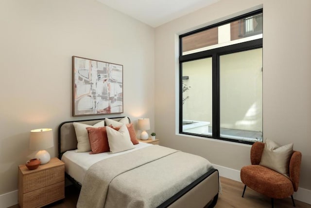 bedroom with wood-type flooring