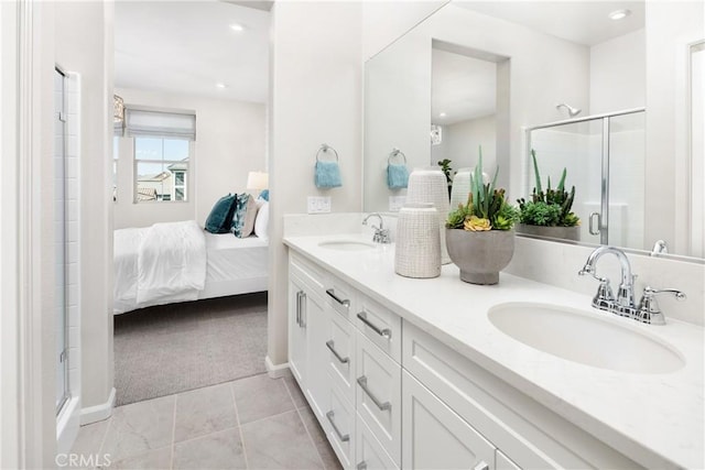 bathroom with vanity, tile patterned floors, and walk in shower