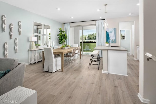 dining room with light wood-type flooring