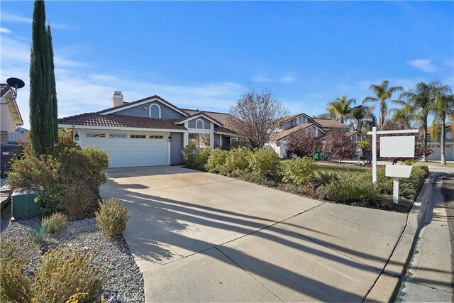 single story home with a garage