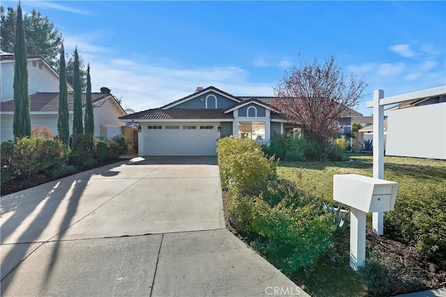 ranch-style home with a front lawn and a garage