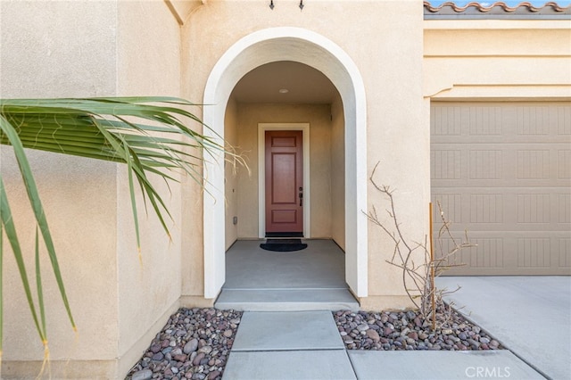 property entrance with a garage