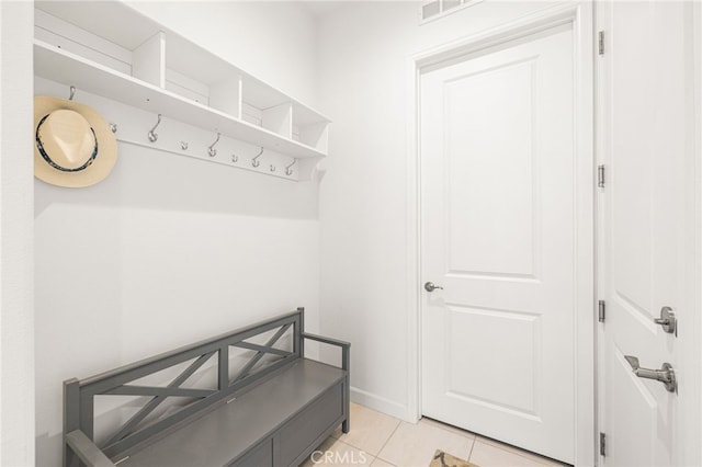 mudroom with light tile patterned flooring