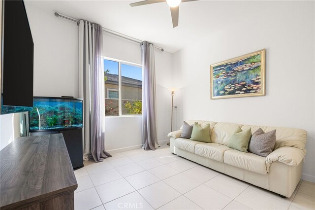 tiled living room featuring ceiling fan