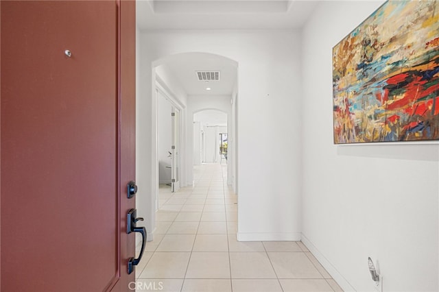 hallway featuring light tile patterned floors