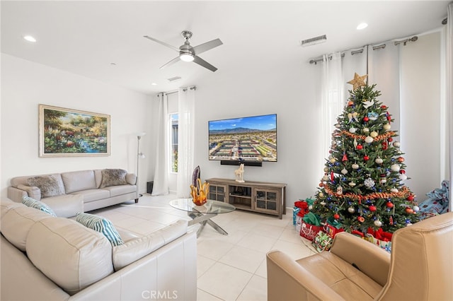 tiled living room featuring ceiling fan