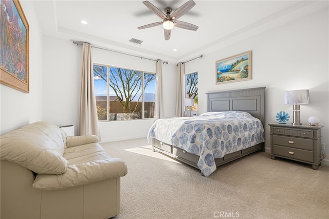 carpeted bedroom with ceiling fan