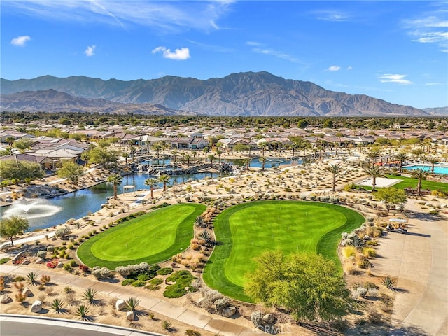 birds eye view of property featuring a water and mountain view