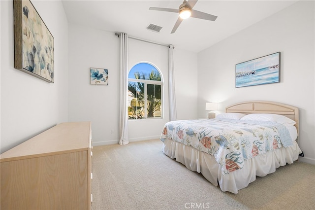 bedroom featuring light carpet and ceiling fan