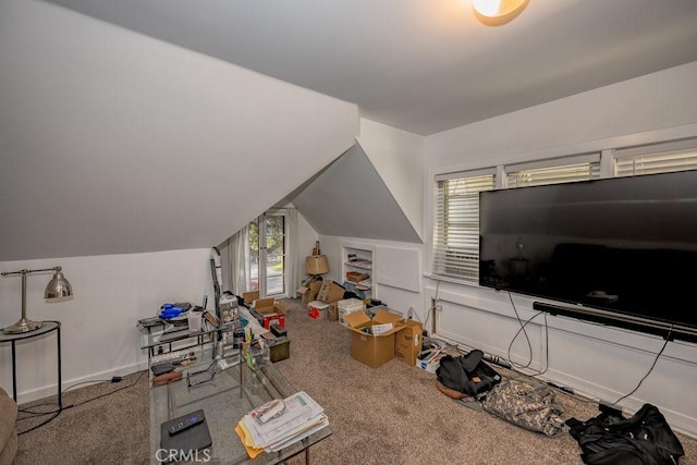 recreation room with carpet floors, vaulted ceiling, and baseboards