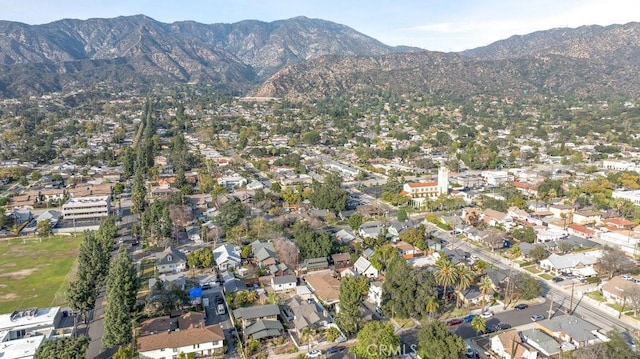 birds eye view of property with a residential view and a mountain view