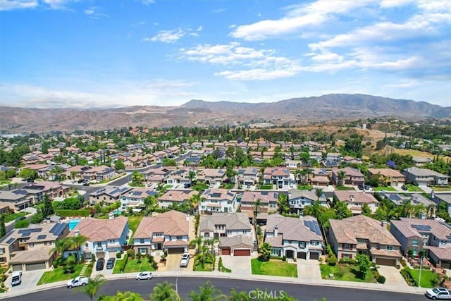 birds eye view of property featuring a mountain view