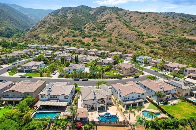 drone / aerial view featuring a mountain view