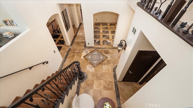 staircase with a high ceiling