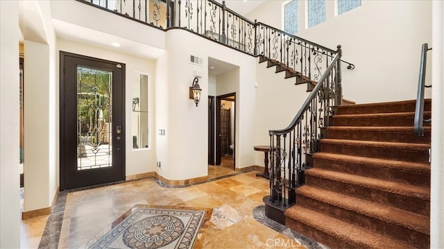 foyer featuring a high ceiling