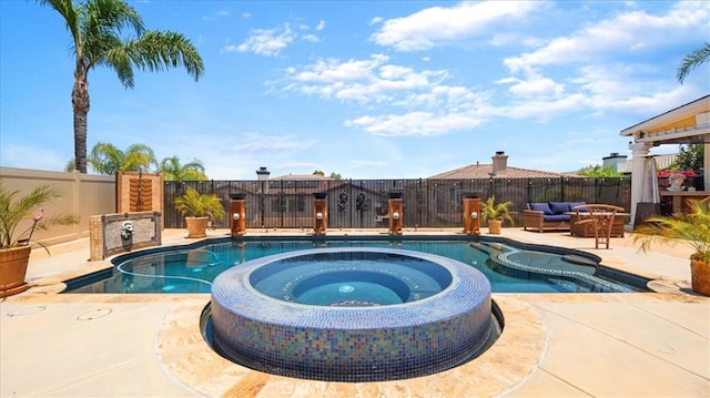 view of pool with an outdoor hangout area, an in ground hot tub, and a patio