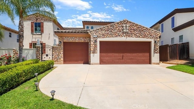 mediterranean / spanish-style house featuring a garage