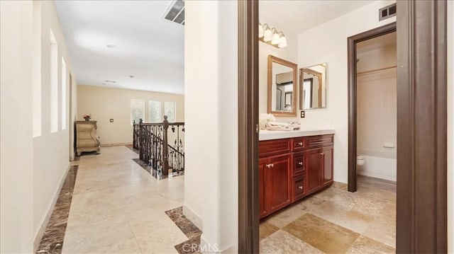 bathroom featuring toilet and vanity