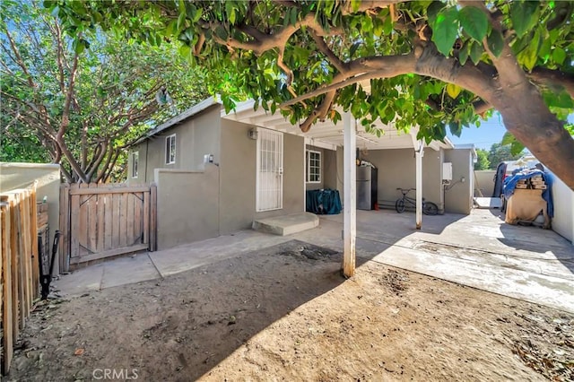 rear view of property featuring a patio area