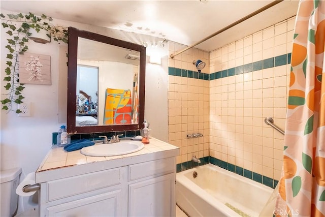 full bathroom with toilet, vanity, and shower / bath combination with curtain