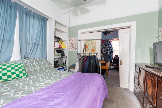 carpeted bedroom featuring ceiling fan