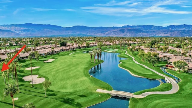 bird's eye view with a water and mountain view