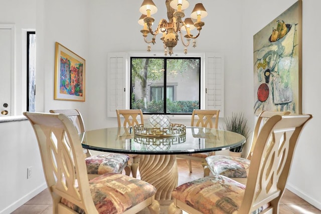 dining space with a chandelier and light tile patterned floors