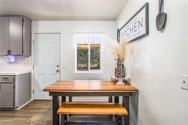 dining area with dark hardwood / wood-style flooring