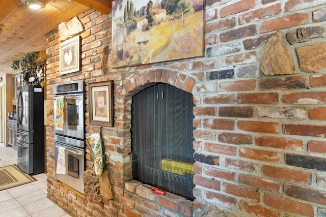 details with wooden ceiling and appliances with stainless steel finishes