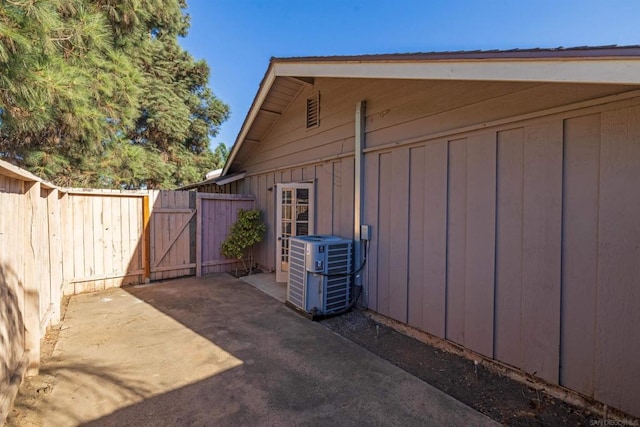 view of property exterior with a patio area and central air condition unit