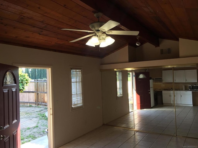 tiled entrance foyer featuring ceiling fan, vaulted ceiling with beams, and wood ceiling