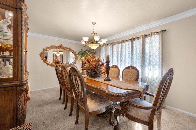 carpeted dining room with a chandelier and ornamental molding