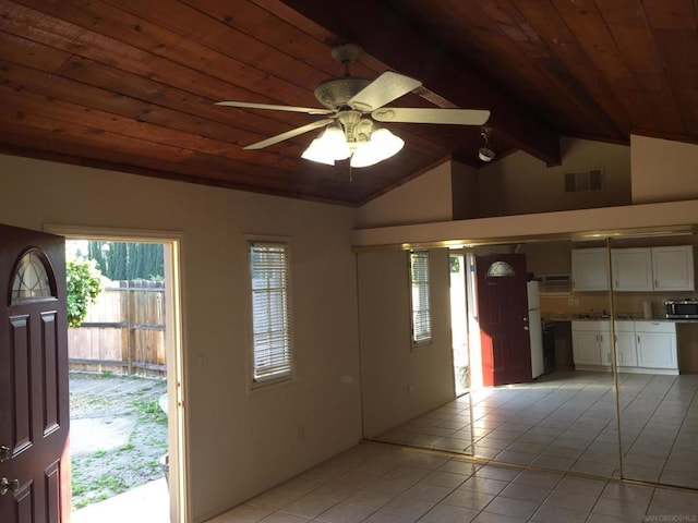 entryway featuring wooden ceiling, light tile patterned flooring, ceiling fan, and lofted ceiling with beams