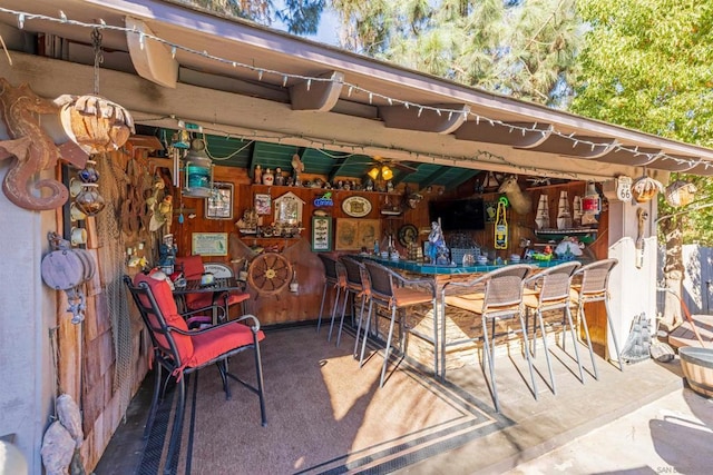 view of patio / terrace featuring an outdoor bar