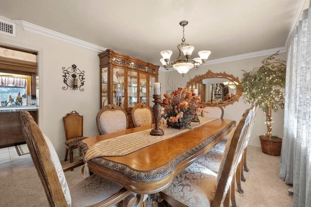 dining room featuring light colored carpet, ornamental molding, and a notable chandelier