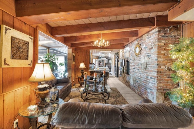 tiled living room featuring beam ceiling, a notable chandelier, wood ceiling, and wooden walls