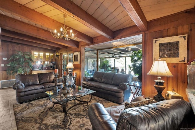 living room with a wealth of natural light, wood walls, and beamed ceiling