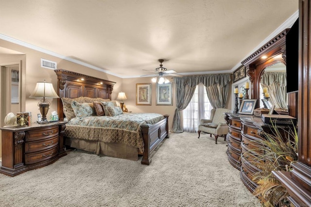 carpeted bedroom featuring ceiling fan and ornamental molding