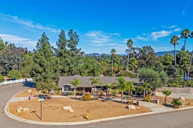 birds eye view of property with a mountain view