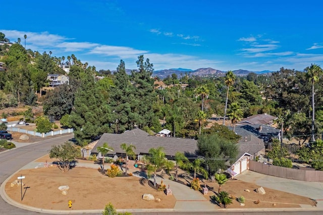 birds eye view of property featuring a mountain view