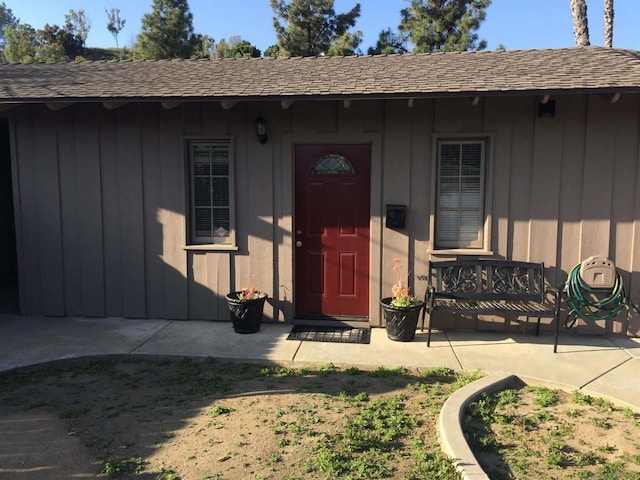 property entrance featuring a patio area