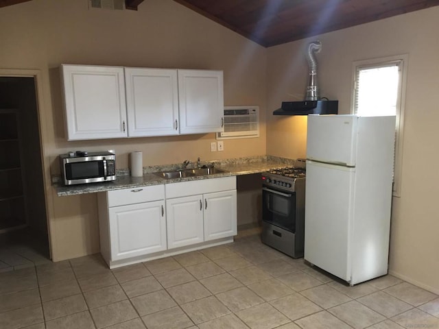 kitchen with appliances with stainless steel finishes, extractor fan, white cabinetry, and sink