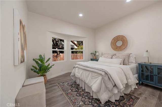 bedroom with hardwood / wood-style floors