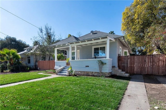 bungalow-style house with a front lawn and covered porch