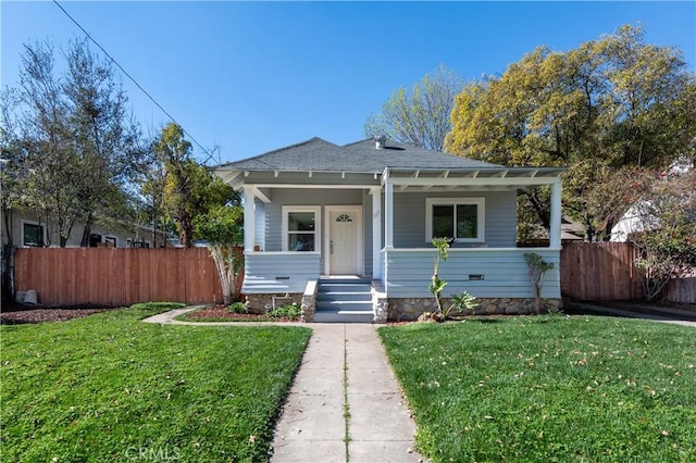 bungalow-style house with covered porch and a front yard