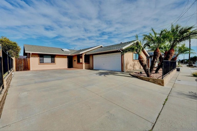 ranch-style house featuring a garage