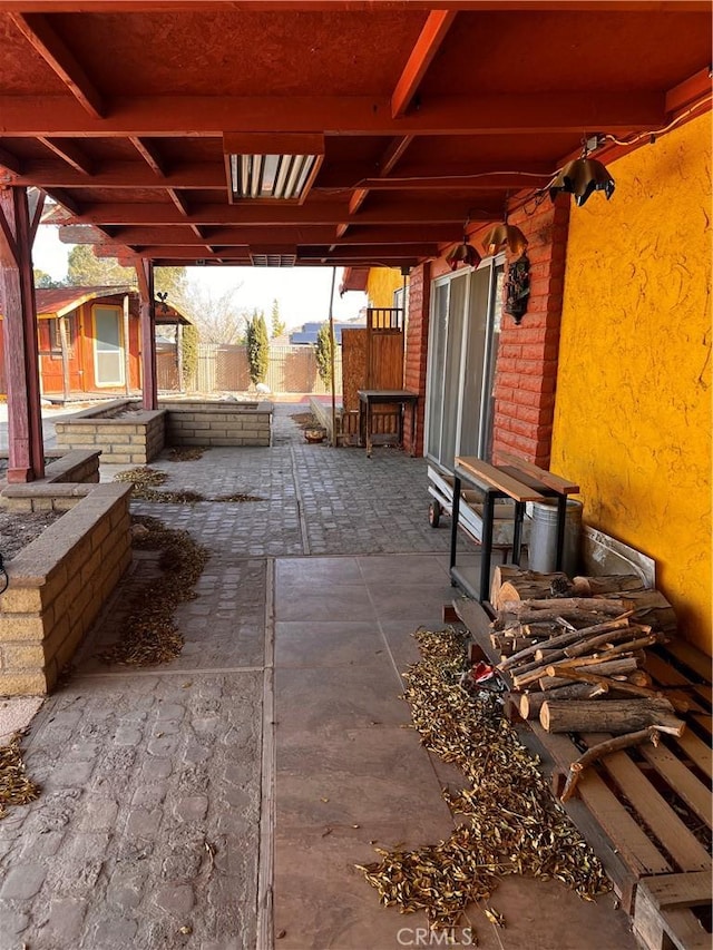 view of patio featuring fence