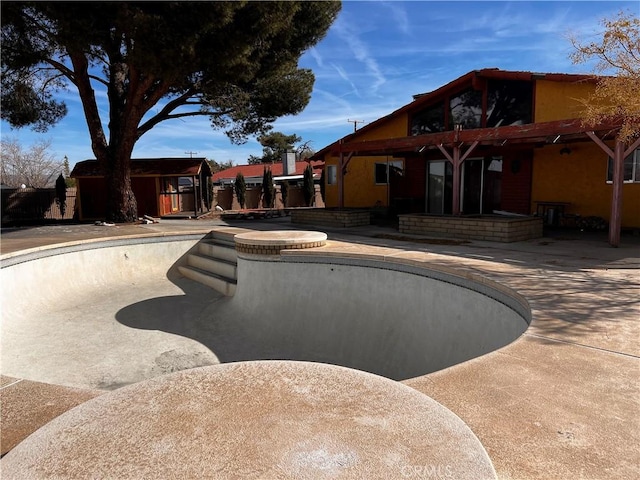 view of pool with a fenced in pool and a patio